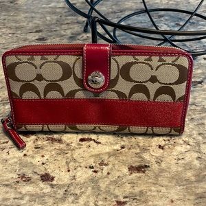 Coach Khaki Signature w/ red trim.  GUC